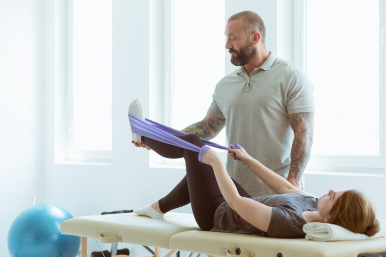 Injured patient lying on a physiotherapy bed